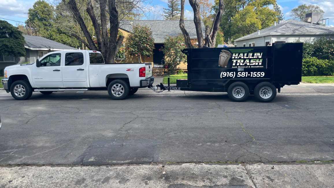 Haulin Trash Junk removal truck and trailer at a job in Sacramento, Ca